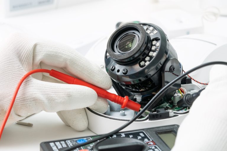 Technician,Repairs,Cctv,Camera,On,The,Table.,Close-up